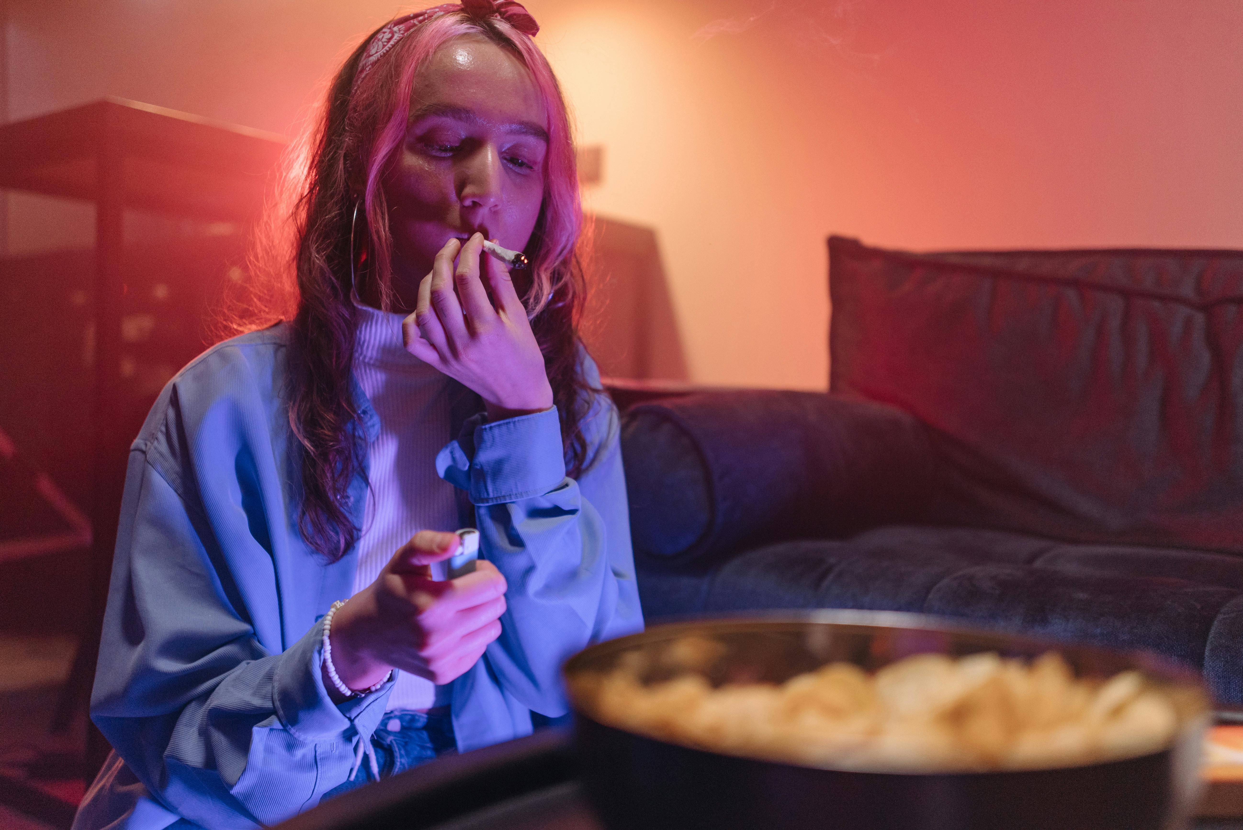a woman smoking at a party