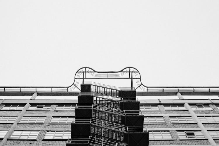 Grayscale Photo Of High Rise Building