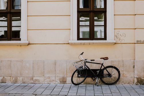 Free A vintage bicycle parked against a classic facade in Bratislava, Slovakia. Stock Photo
