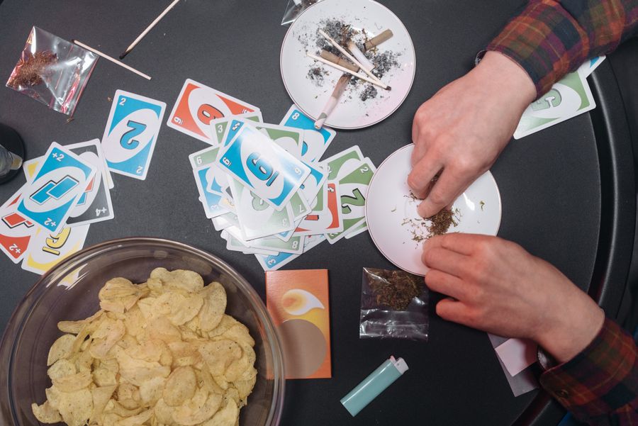 Hands holding Uno cards
