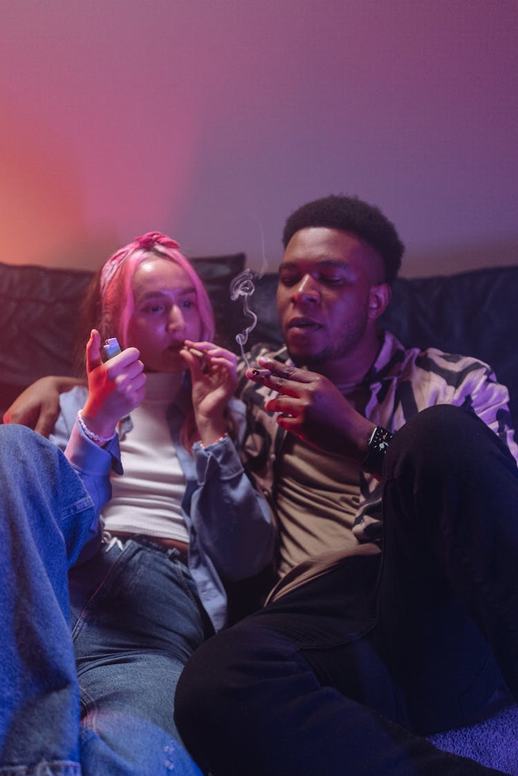 Man And Woman Smoking Marijuana Together