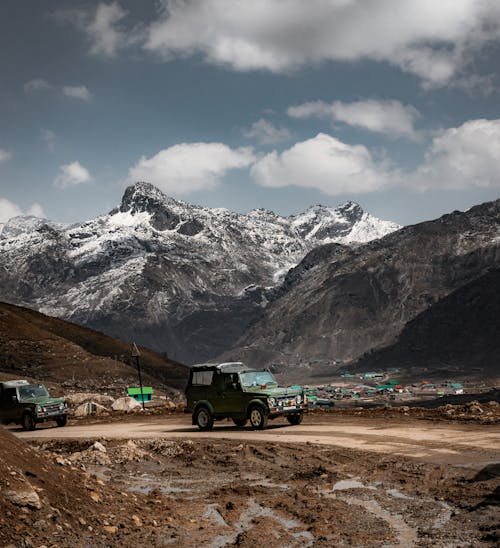 Cars Driving on Unpaved Road