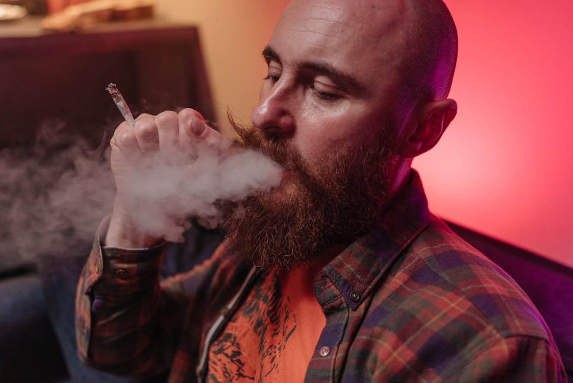 Free Close-up Photo of a Man Smoking a Joint Stock Photo