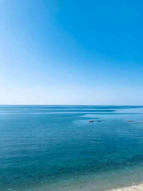 Free A breathtaking view of the blue ocean and sky in Ligao, Bicol, Philippines. Perfect tranquility. Stock Photo