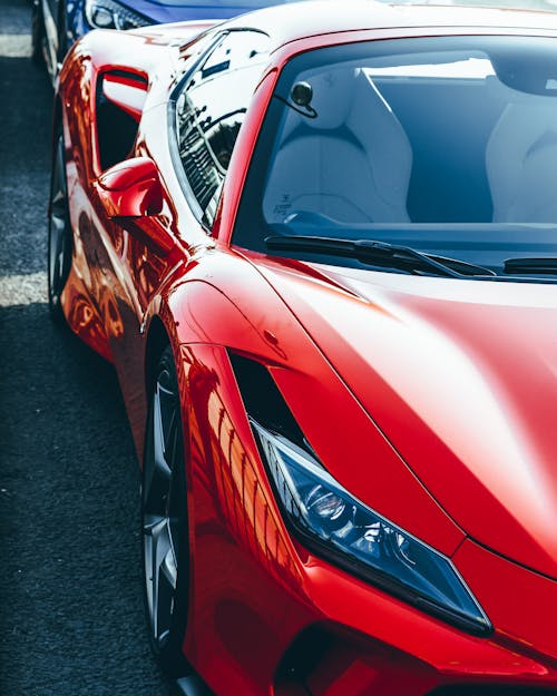 Close-Up Shot of a Red Sports Car Parked on the Road