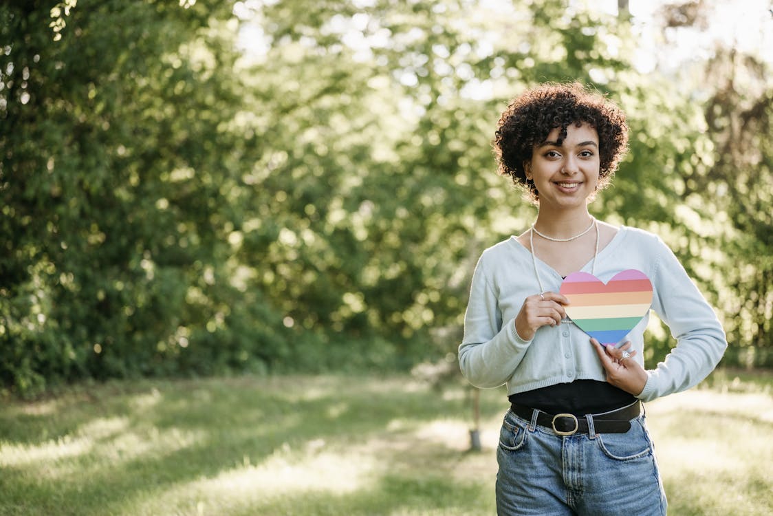 A Woman Holding a Stripe Heart 