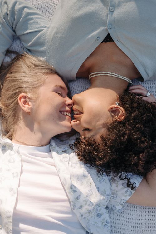 Free Two women sharing a tender and intimate moment of affection, symbolizing love and pride. Stock Photo
