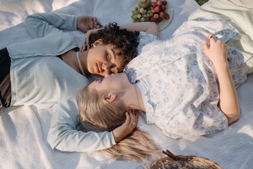 Free Two Women Lying Down Together Stock Photo