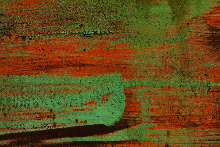 Close-up Of An Abstract Painting In Green And Orange 