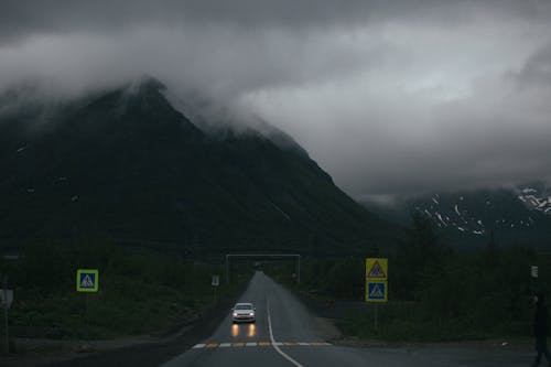 Car on the Road Near a Mountain