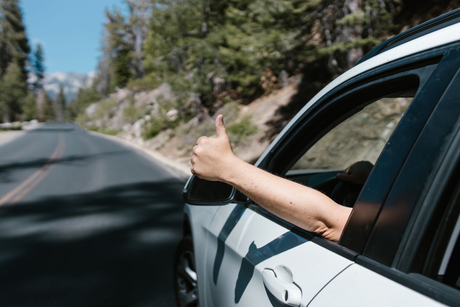 Person checking wrist and hand position in bright natural light