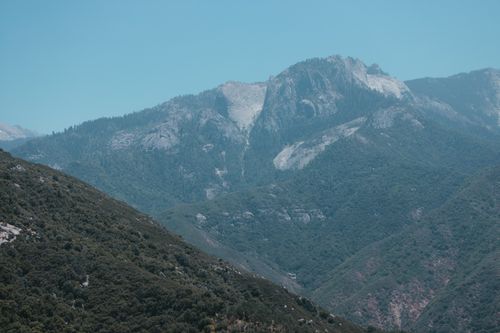 Free Breathtaking view of a lush mountain range in a national park under a clear blue sky. Stock Photo