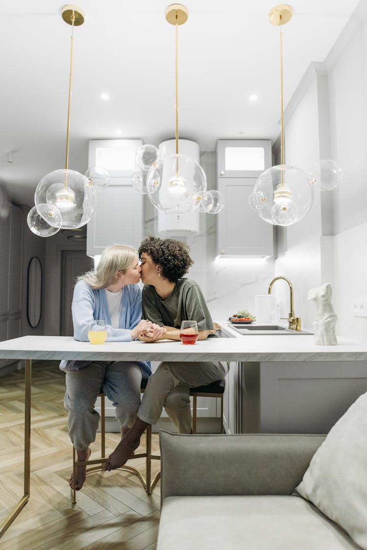 Women Kissing In The Kitchen