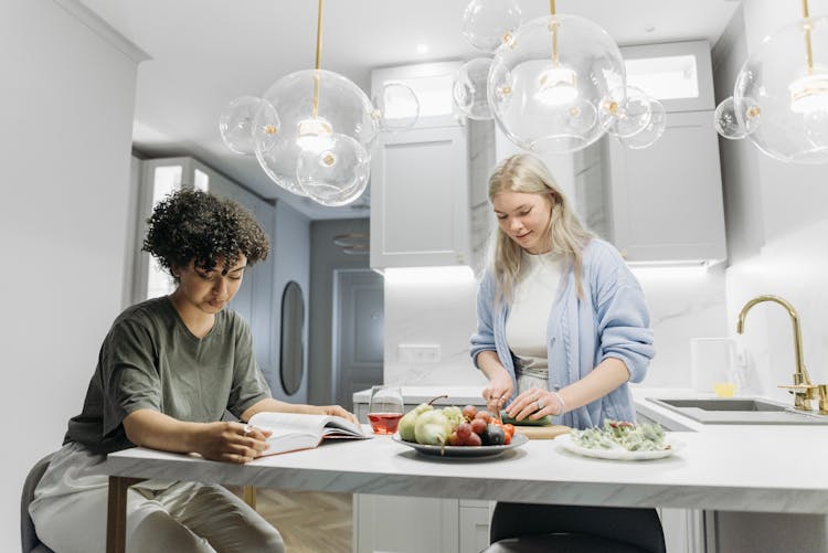 Women Preparing Food On The Table