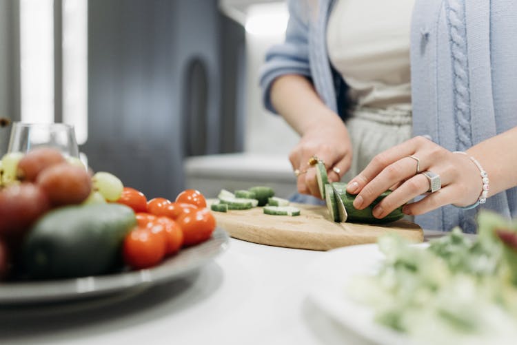 Person Slicing Cucumber