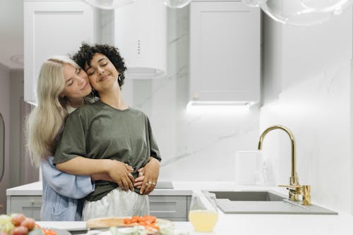 Free A Couple's Sweet Moments Together in the Kitchen Stock Photo