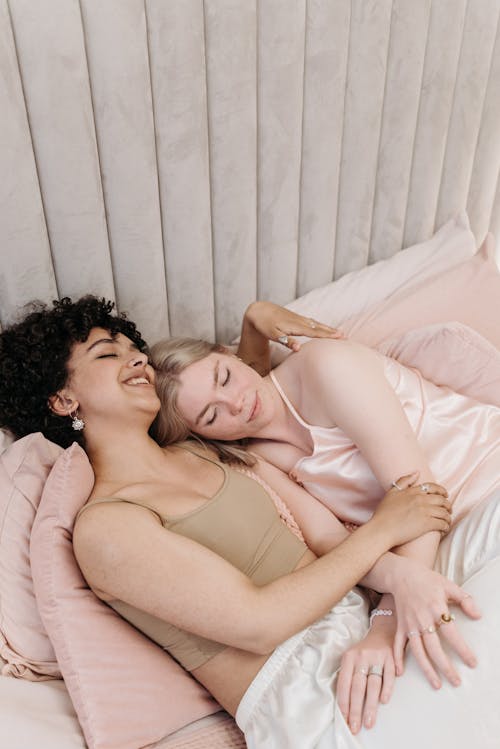 Free A Couple Lying in Bed Together Stock Photo