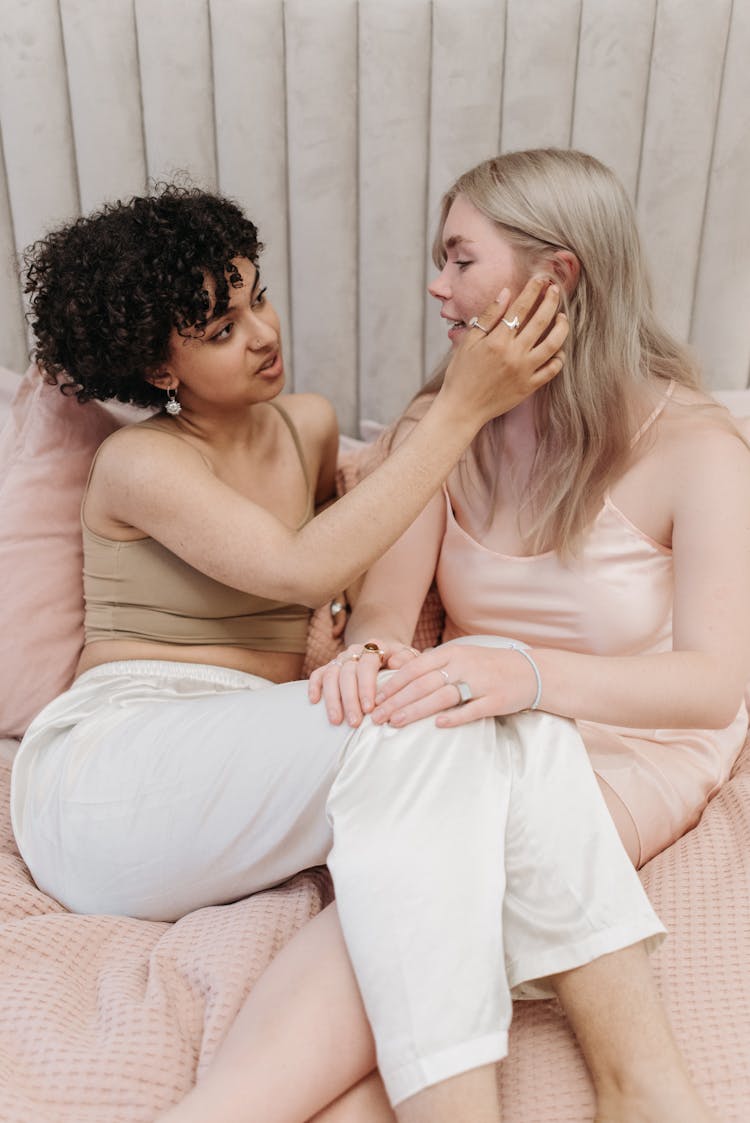 Women Sitting On Bed