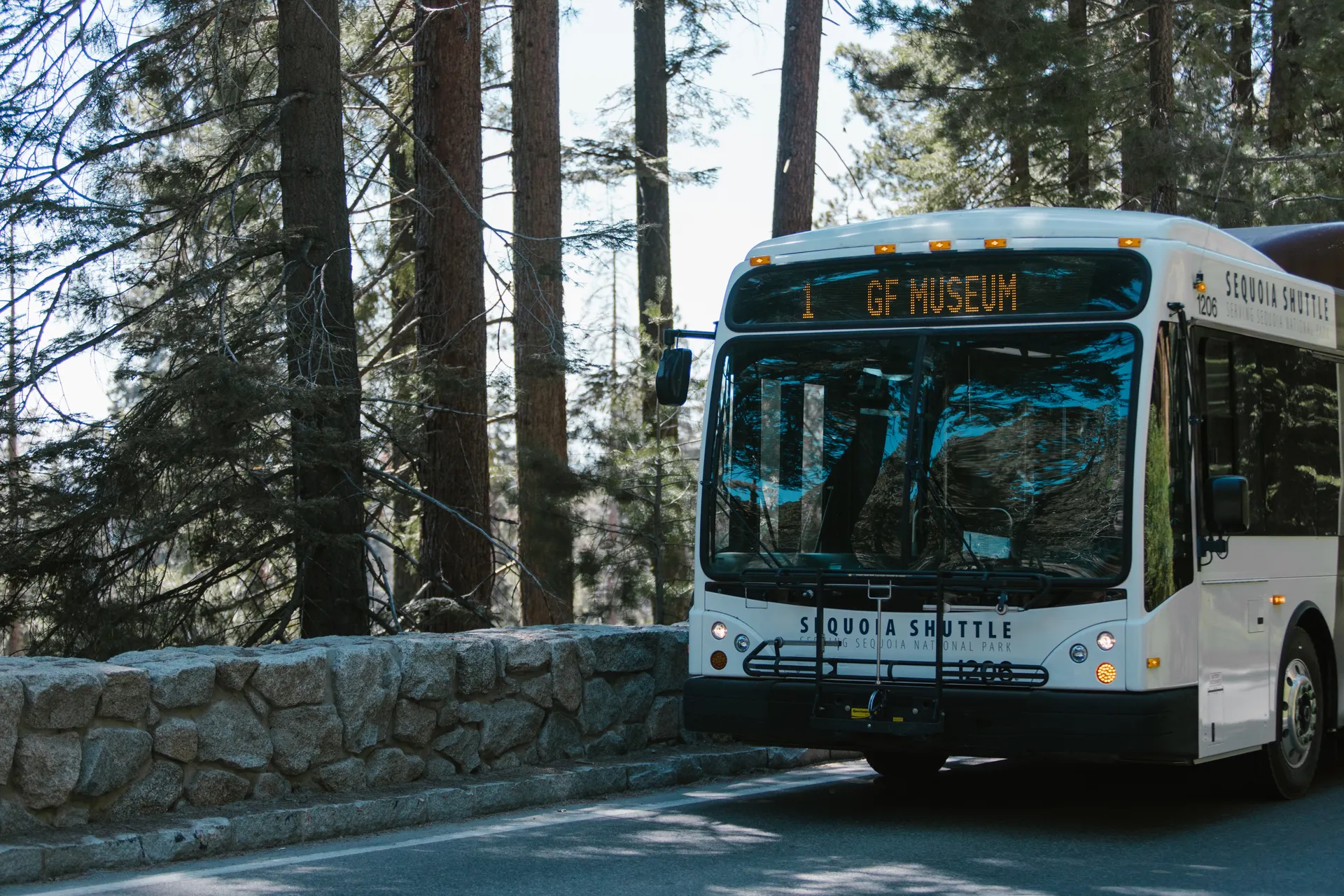 Sequoia shuttle bus in a forest setting within a national park. Sequoia shuttle bus in a forest setting within a national park.