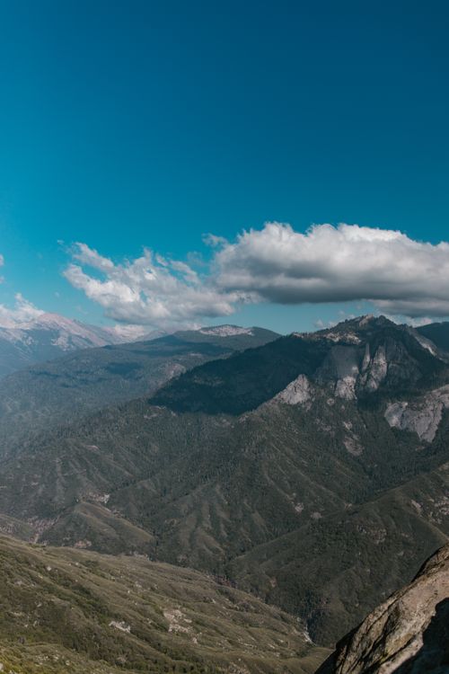 Free Breathtaking mountain landscape under a clear blue sky, perfect for travel and nature enthusiasts. Stock Photo