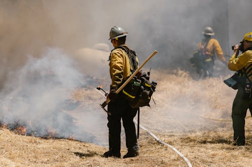 A Firefighter Holding a Hoe