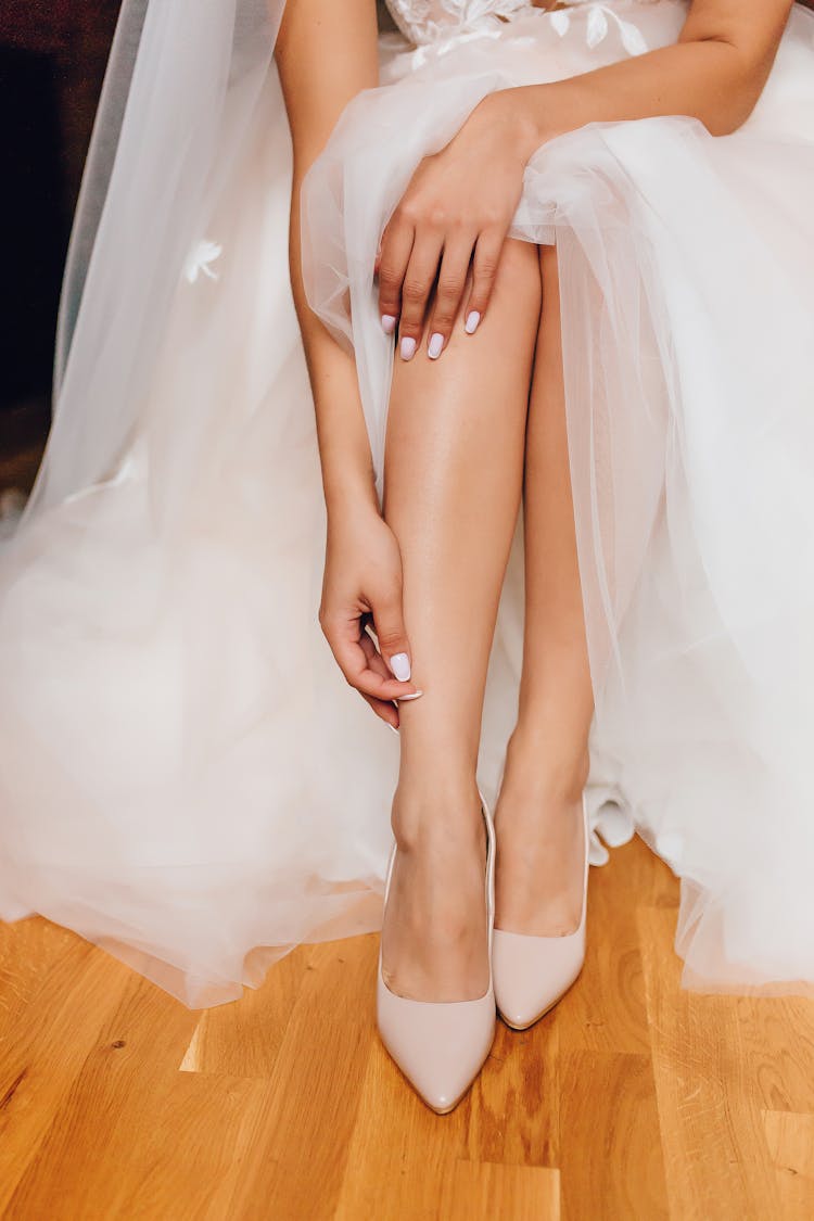 Close-up Of Bride Putting On High Heels 