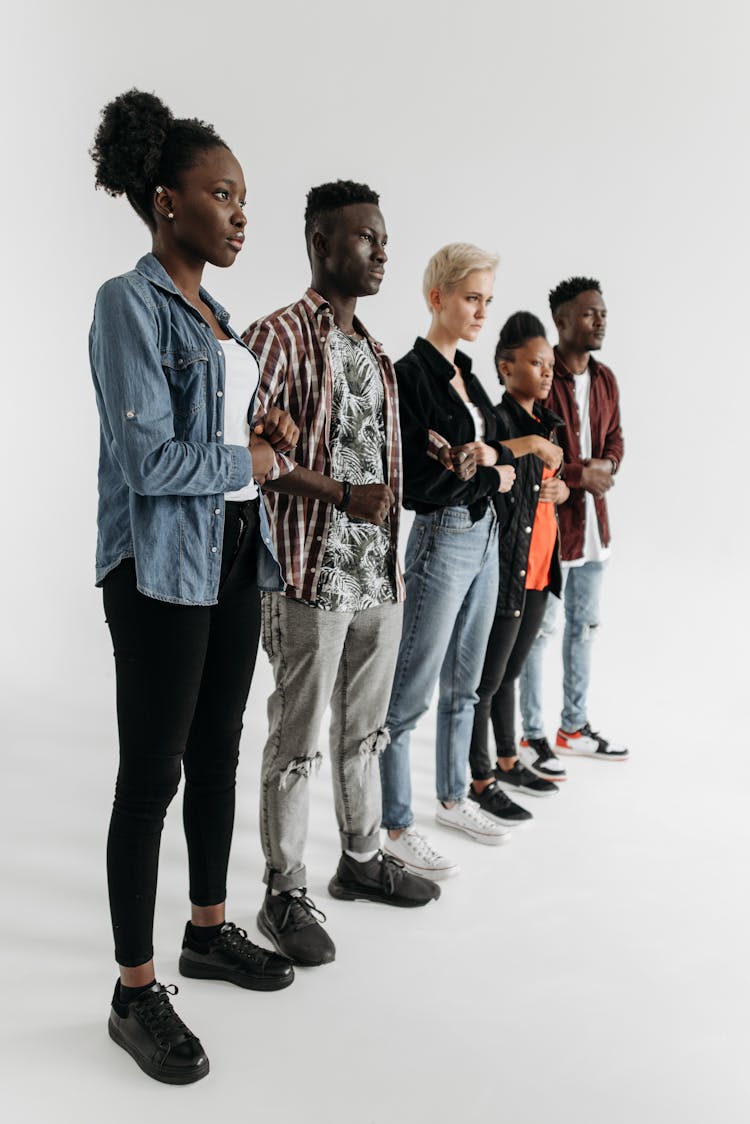 Group Of Men And Women Standing Together In A Row 