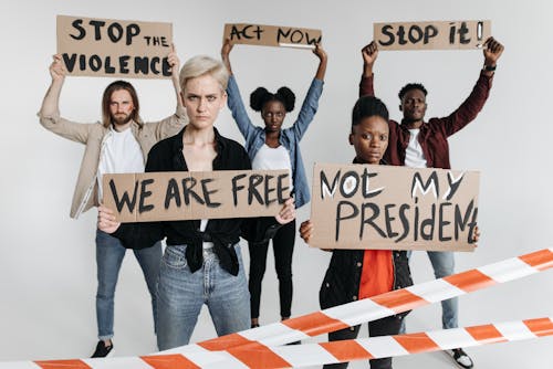 People Holding Posters