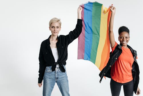 Two Women Holding a Rainbow Flag