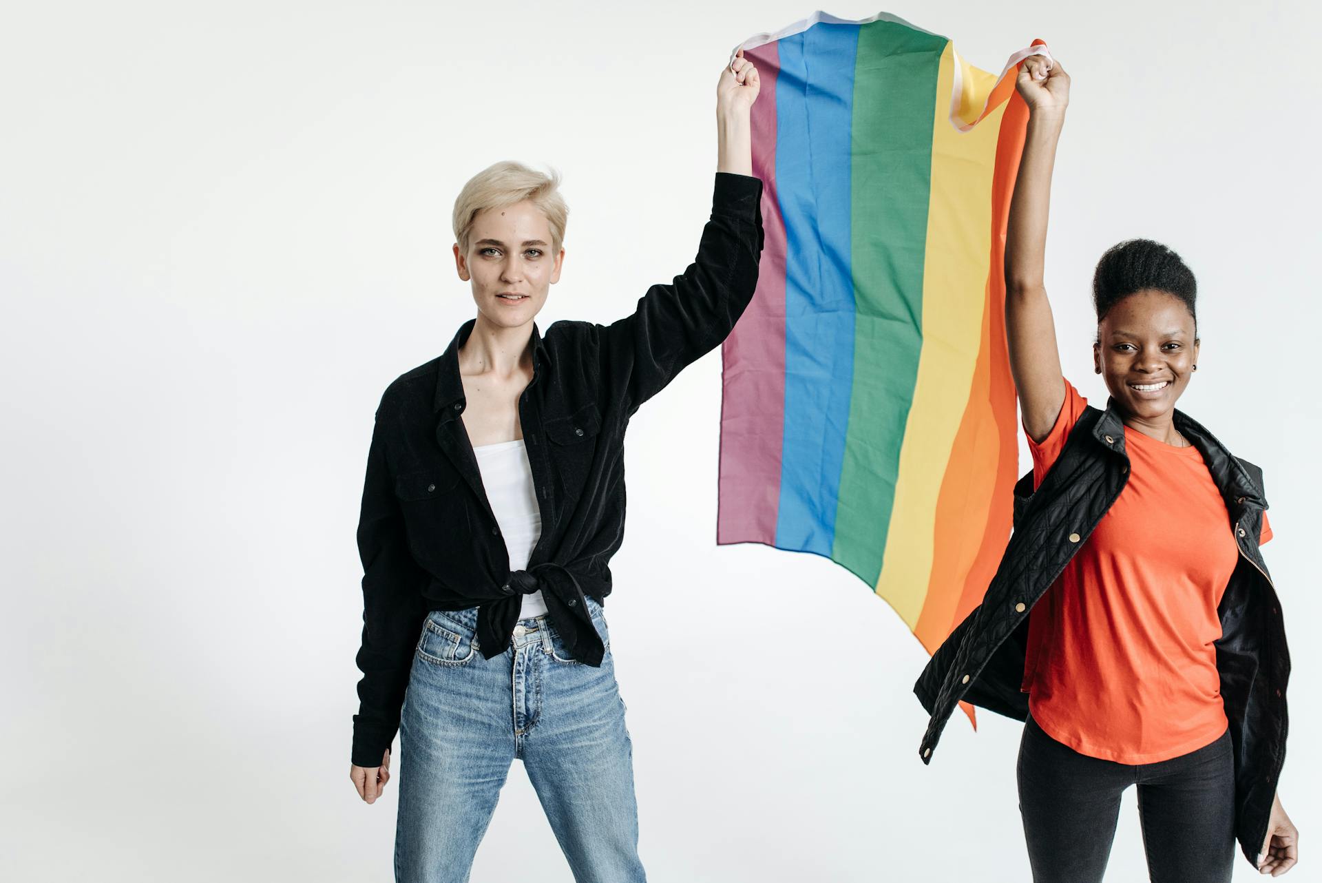 Two Women Holding a Rainbow Flag