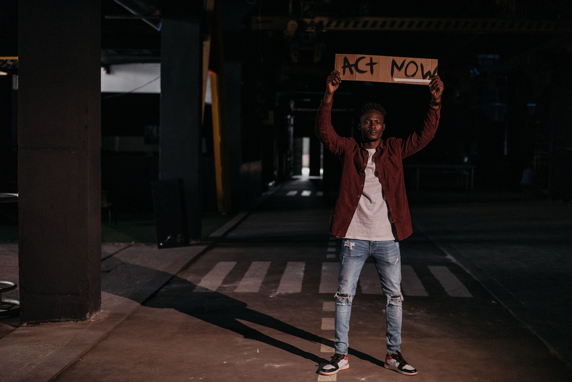 A Man Holding a Poster