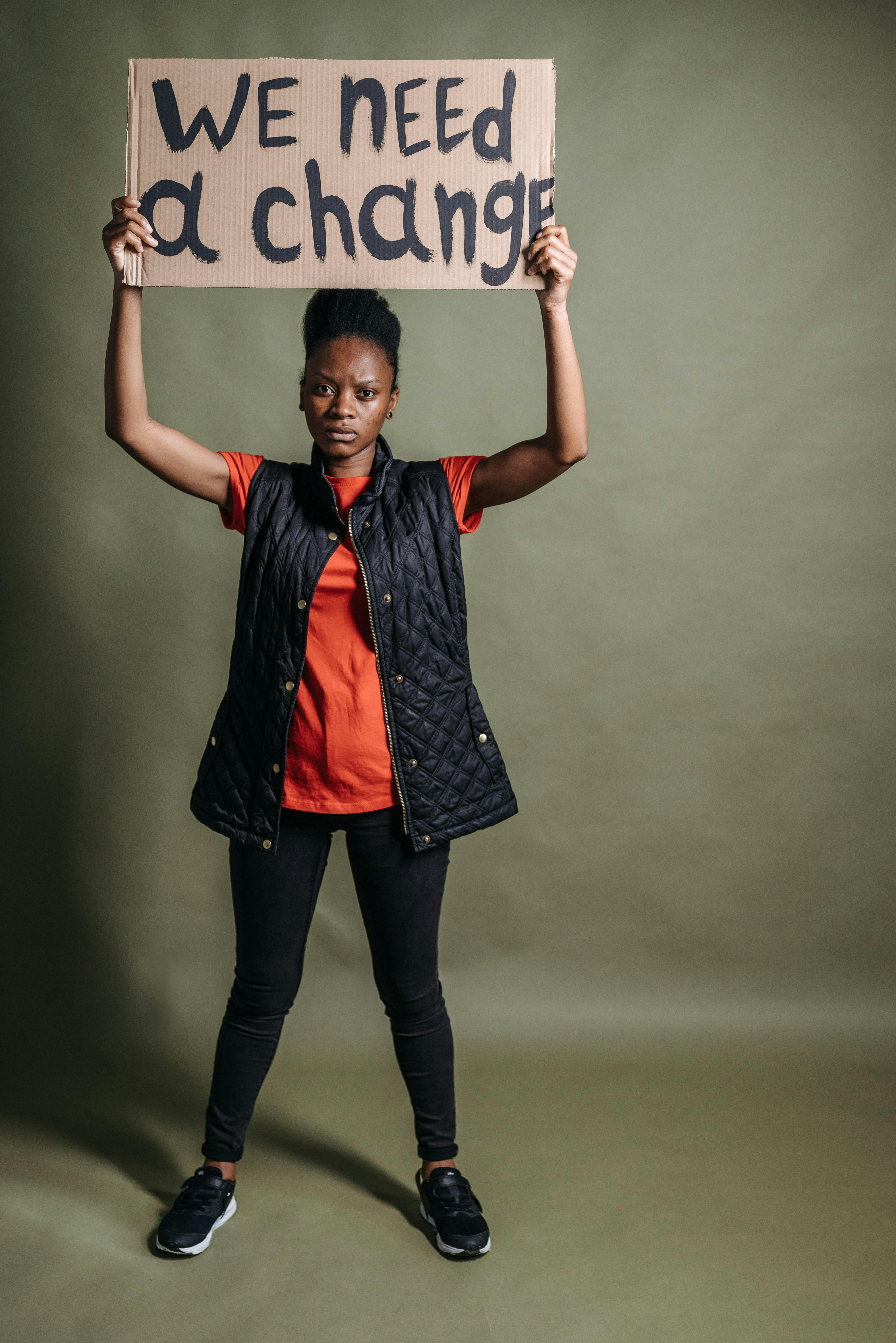 woman holding a banner above her head