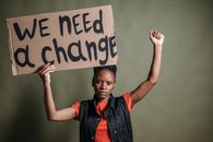 A Woman Holding a Placard