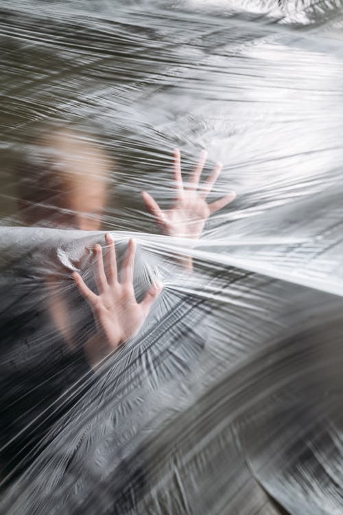 A Person Holding Clear Plastic