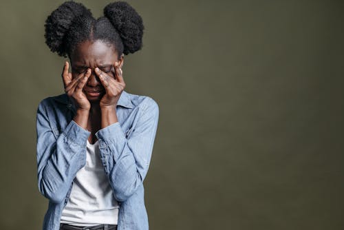 Woman Touching Closed Eyes