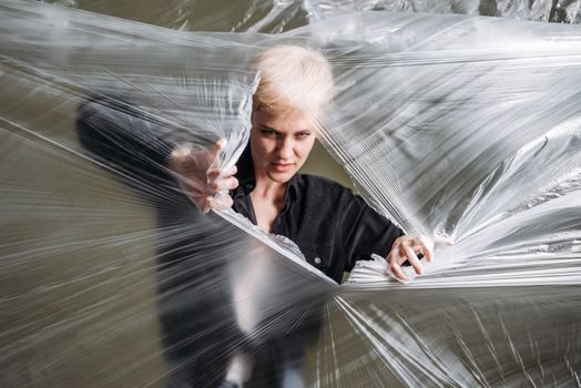 A Woman Ripping Plastic
