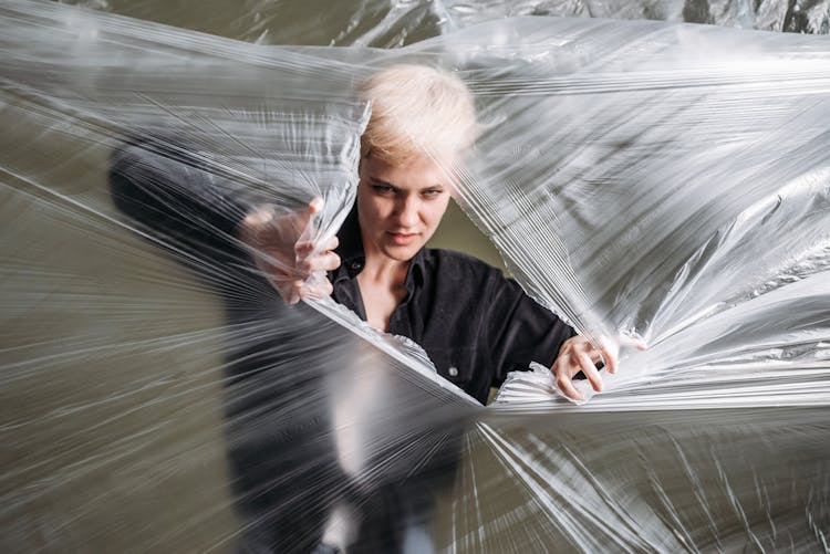 A Woman Ripping Plastic