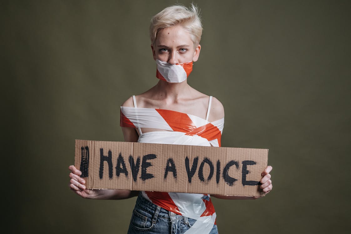 A Woman Holding saying I have a voice