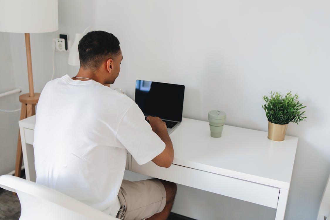 A Man Sitting at the Table · Free Stock Photo