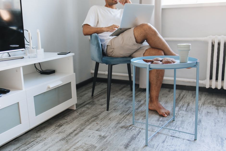 The Perfect Desk Setup for Hyderabad Homes: A Simple Guide to Work Desk Shipping Person working at a foldable work desk in a modern Hyderabad home office