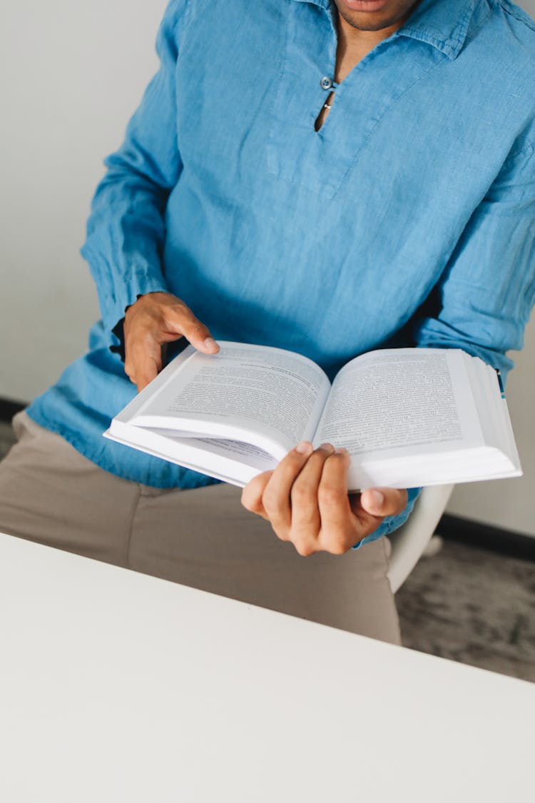 A Person Reading A Book 