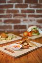 Close-Up Shot of Delicious Food on Wooden Chopping Board