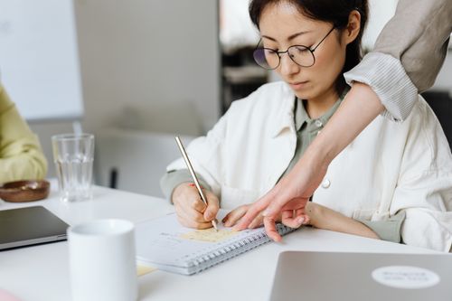 Free Businesswomen collaborating in an office, actively engaged in planning and discussion. Stock Photo