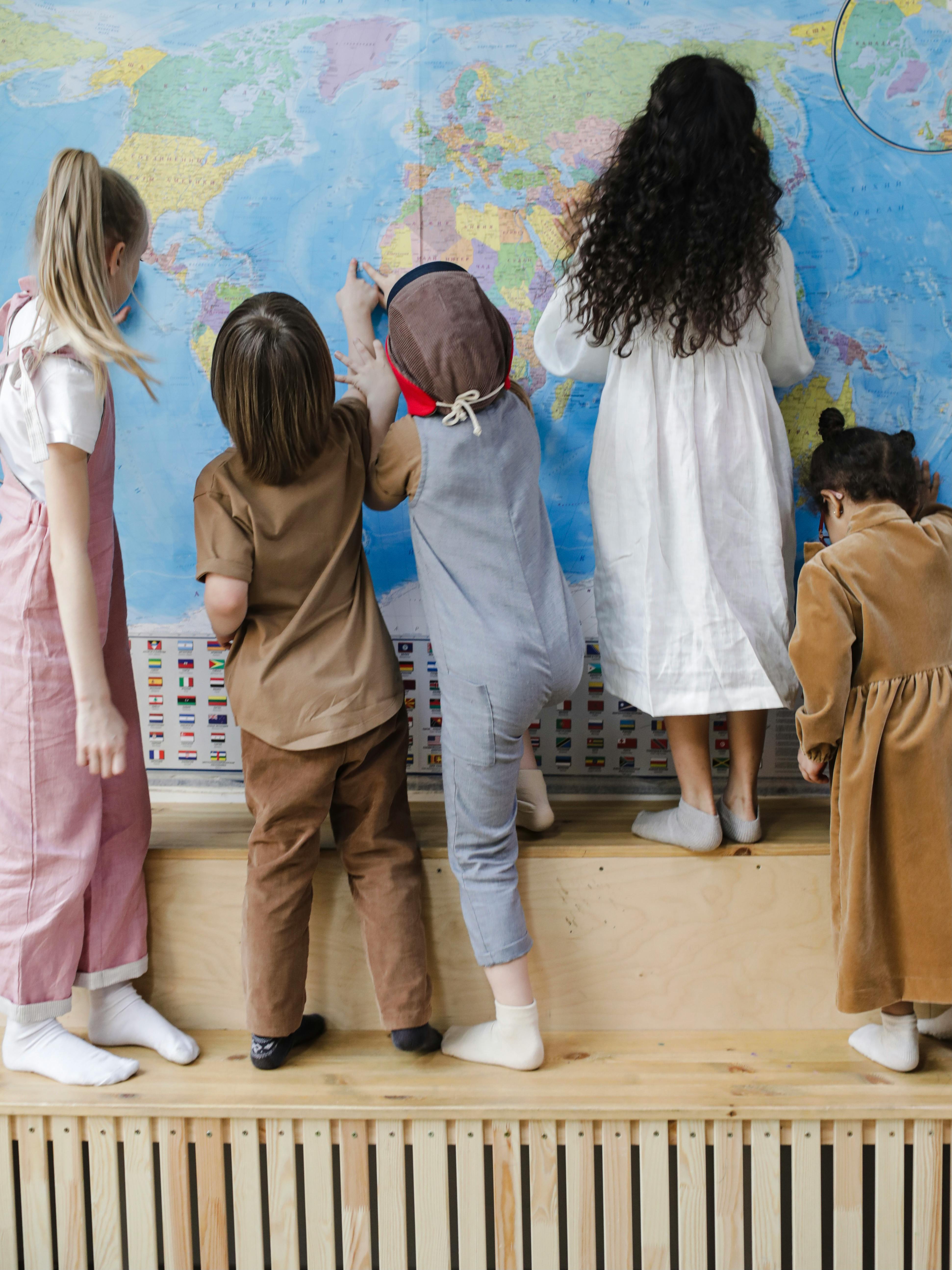 back view of a children looking the map