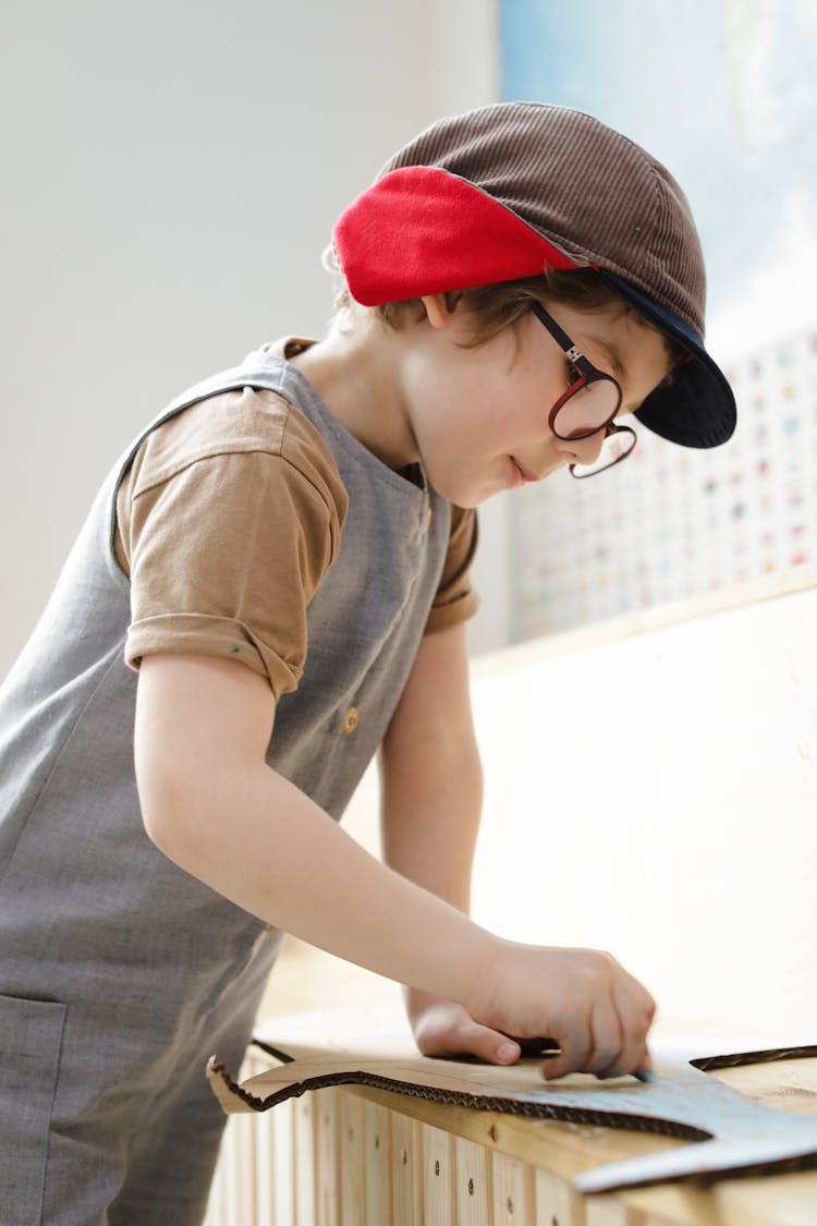 Boy Coloring His Cardboard