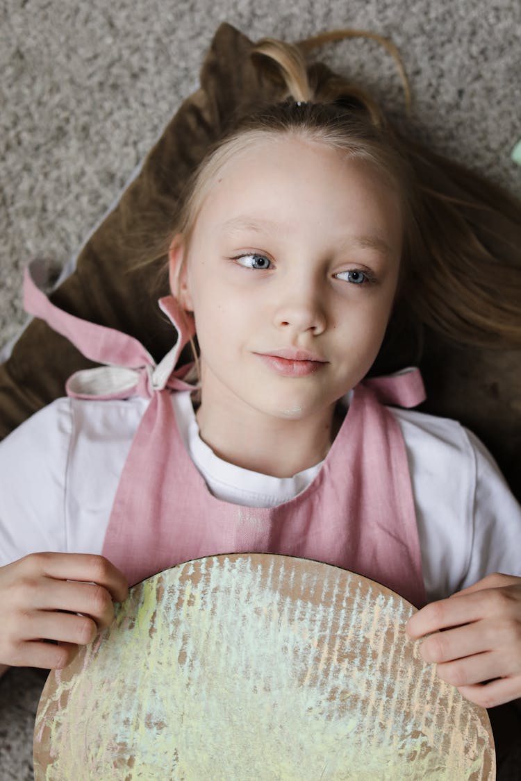 Girl Holding Her Artwork