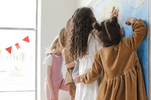 Young children learning geography with a map in a classroom setting.