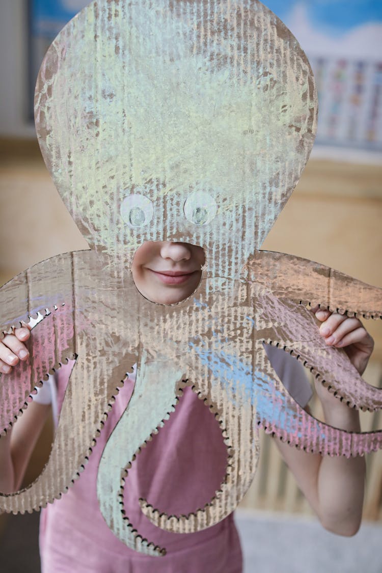 Person Holding A Cutout Octopus