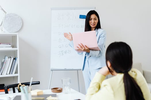 Professional woman presenting financial results to a colleague in a modern office.