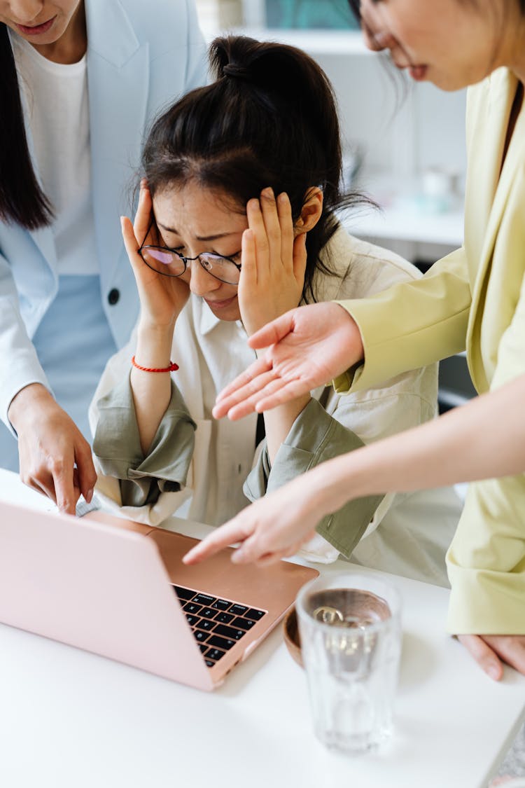 Women Pointing At The Laptop